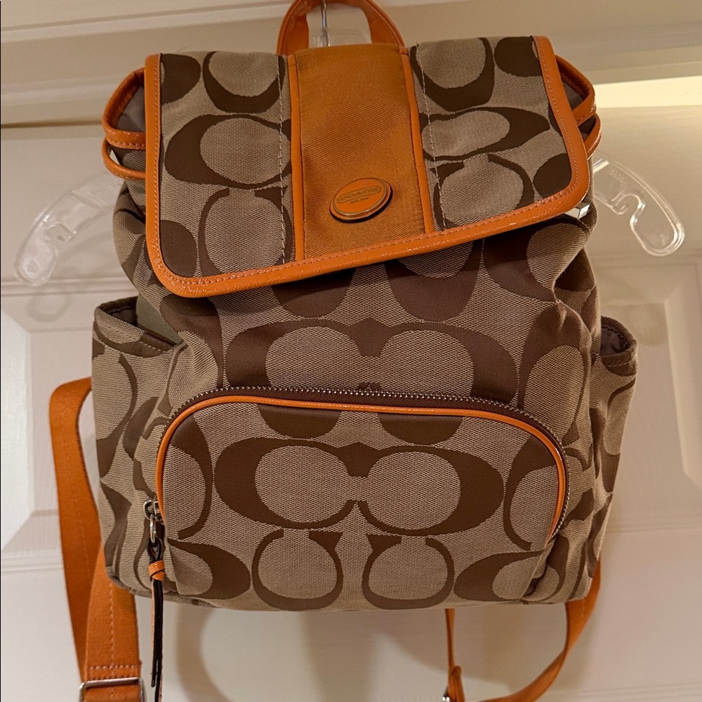 Coach signature fabric backpack w/orange patent leather trim Great condition!